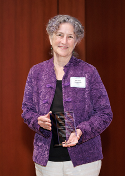 Melanie Eberhart receiving her 2026 Administrative Excellence Award
