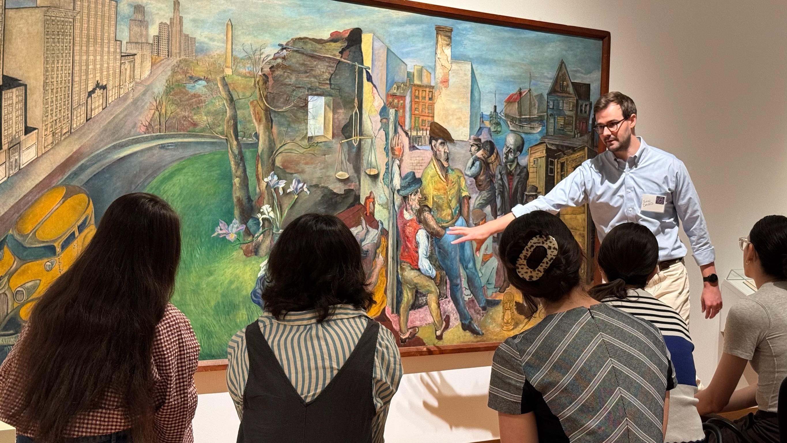 Residents looking at a painting in an art gallery. 