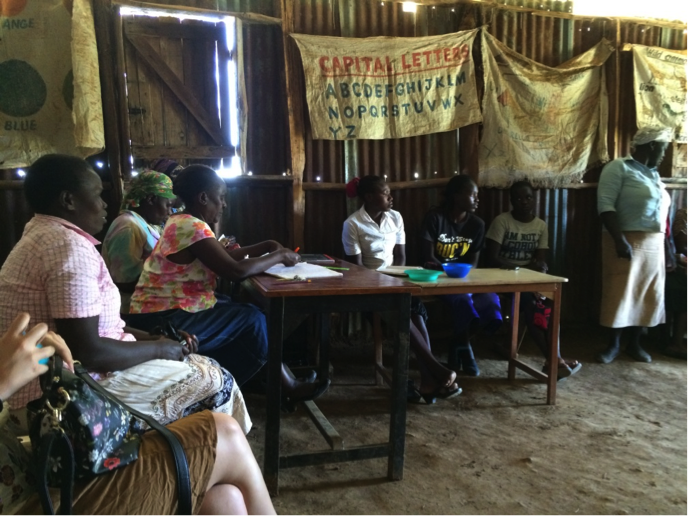 Microfinance group in action, meeting in a rural school room. This group returned 100% dividend on investment in 2015.