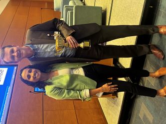 Research Day cup presented to Dr. Andrew Muir