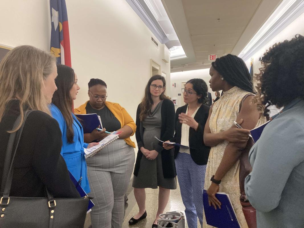 Sabrina Layne talking to Elizabeth Adkins, the Chief of Staff for Representative Valerie Foushee