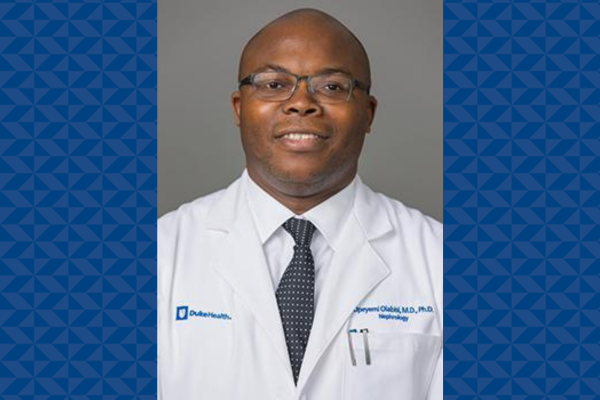 Dr. Olabisi's headshot with his white coat