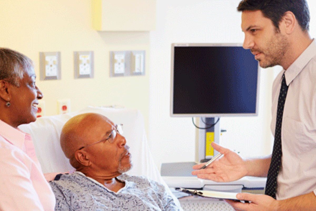 photo of doctor consulting with patient and family