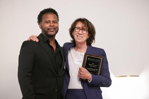 Dr. Julius Wilder presents Dr. Laura Svetkey with the Kimberly J. Evans Award