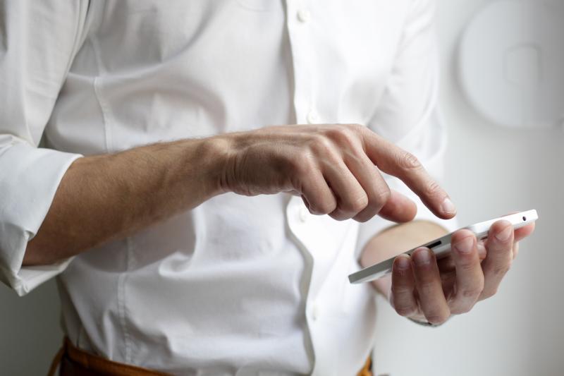 Man scrolling on phone