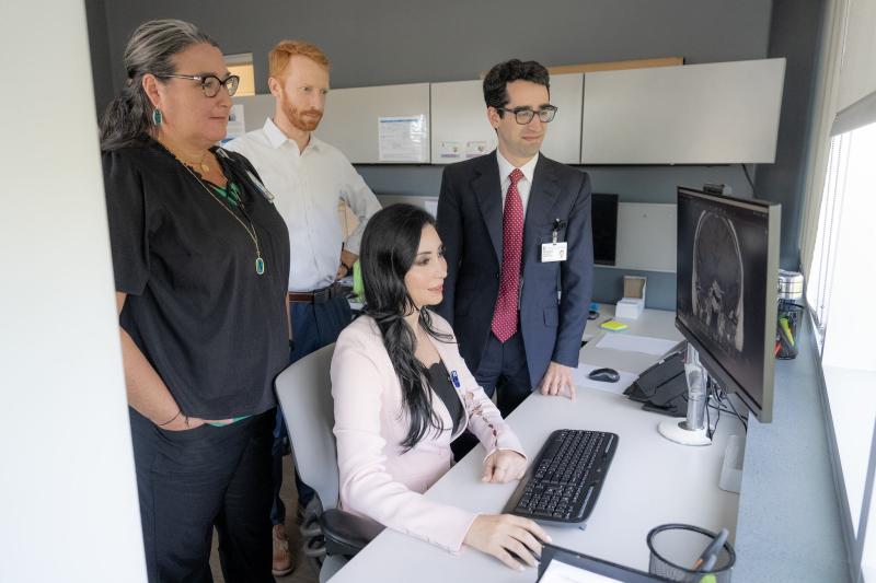 Denise Lally-Goss, ANP; Patrick Codd, MD; Leena Shahla, MD; and Jordan Komisarow, MD, sit in front of a computer