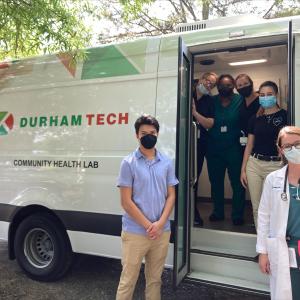 Resident Emory Buck, MD, and a Durham Tech crew of faculty and students prepare to go our for patient visits