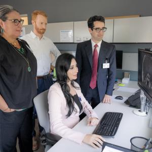 Denise Lally-Goss, ANP; Patrick Codd, MD; Leena Shahla, MD; and Jordan Komisarow, MD, sit in front of a computer