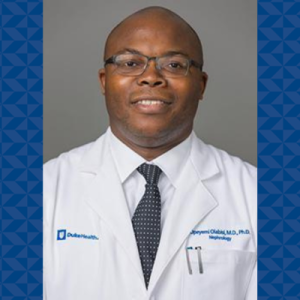 Dr. Olabisi's headshot with his white coat
